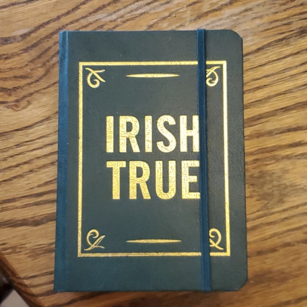 Tullamore Dew Irish whiskey flask in a book